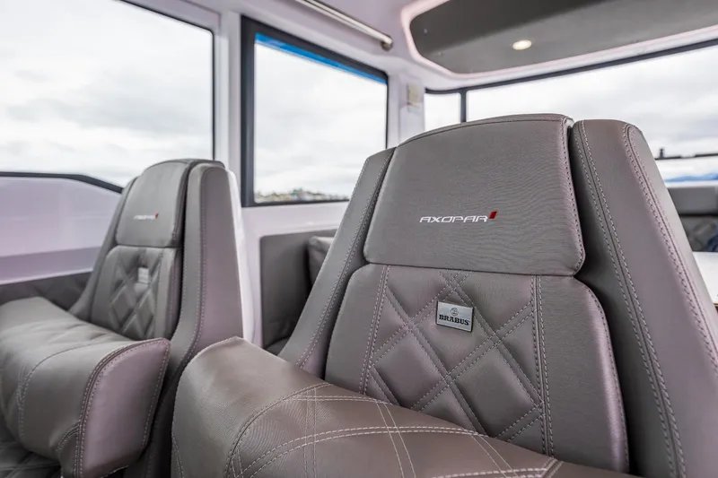 Slide: The Image of 2021 Axopar 37xc Wetbar interior with luxurious leather seating. - 26