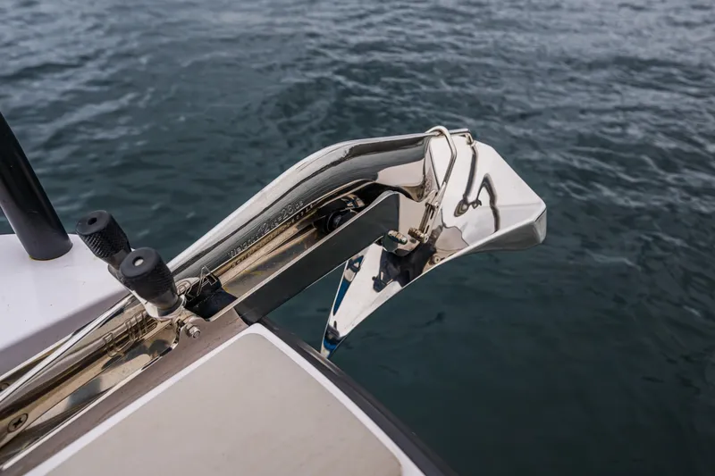 Slide: The Image of 2021 Axopar 37xc Wetbar boat anchor detail over water. - 32