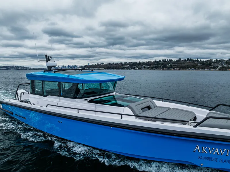 Slide: The Image of 2021 Axopar 37xc Wetbar boat cruising on a cloudy day. - 4