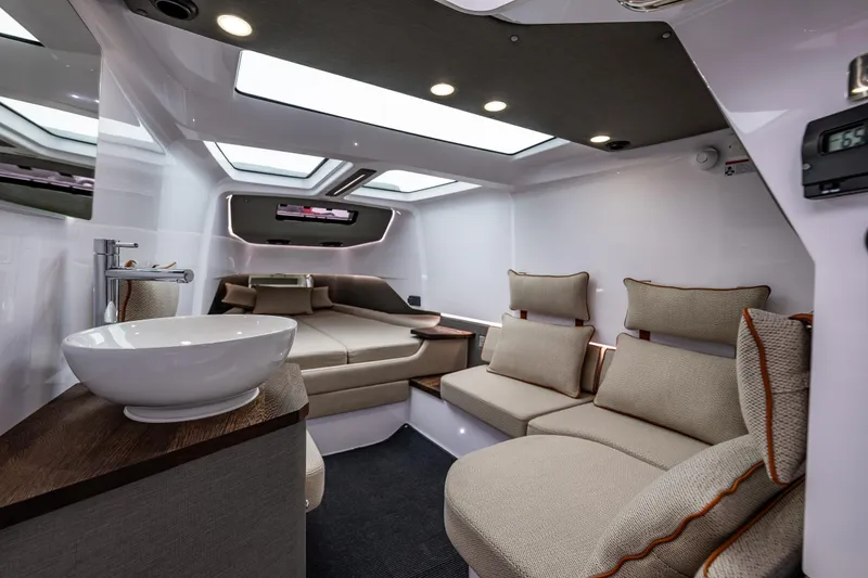 Slide: The Image of Luxurious interior of 2021 Axopar 37xc Wetbar with modern seating and skylights. - 49