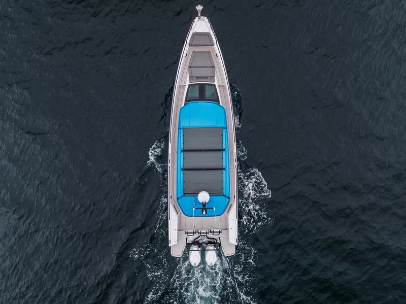 Slide: The Image of Aerial view of 2021 Axopar 37xc Wetbar cruising on open water. - 9