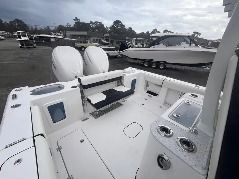 Slide: The Image of 2025 Tidewater 302 CC Adventure boat with dual engines, spacious deck, and modern amenities. - 18