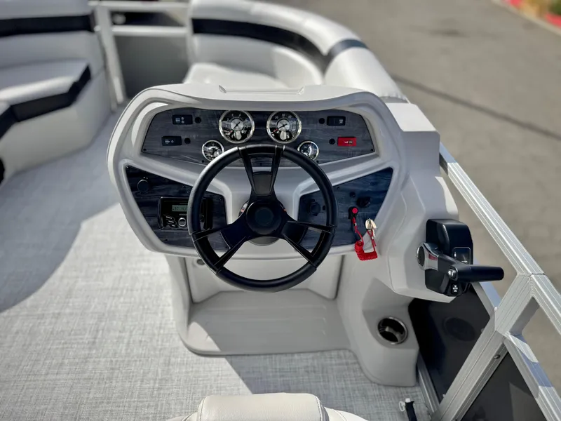 Slide: The Image of 2025 Berkshire 20 CRSE boat dashboard with steering wheel and control panel. - 16