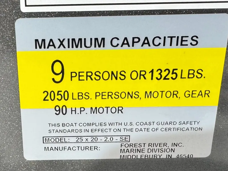 Slide: The Image of 2025 Berkshire 20 CRSE boat capacity label: 9 persons, 1325 lbs, 90 HP motor. - 21