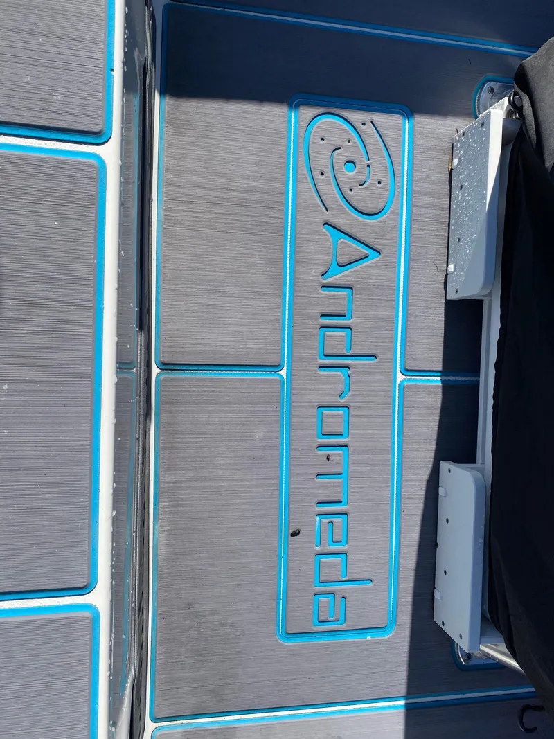 Slide: The Image of 2016 Tidewater 2200 Carolina Bay boat deck with "Andromeda" logo in blue. - 16