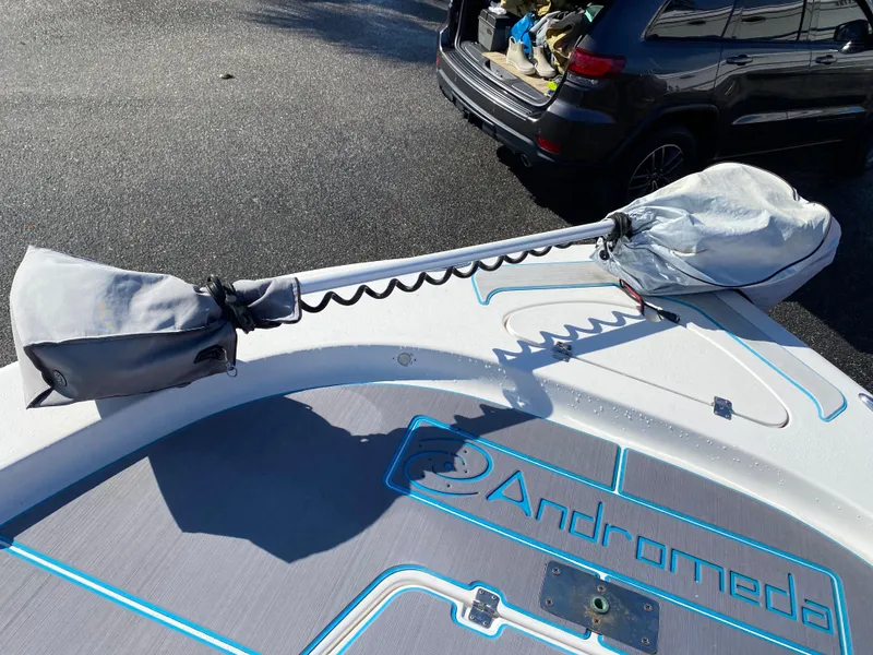 Slide: The Image of 2016 Tidewater 2200 Carolina Bay boat with covered equipment on deck. - 18