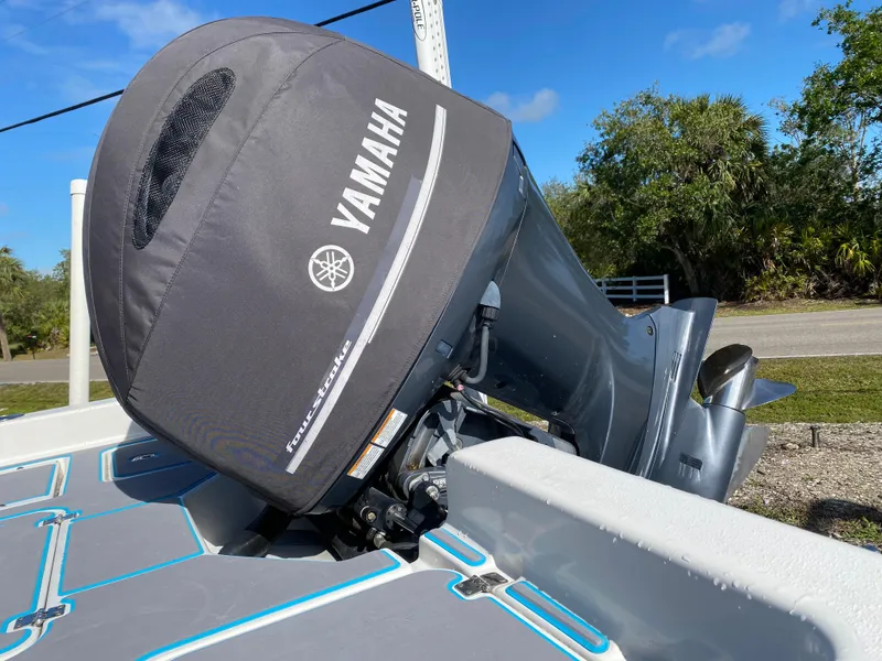Slide: The Image of 2016 Tidewater 2200 Carolina Bay with Yamaha outboard motor, parked outdoors. - 19