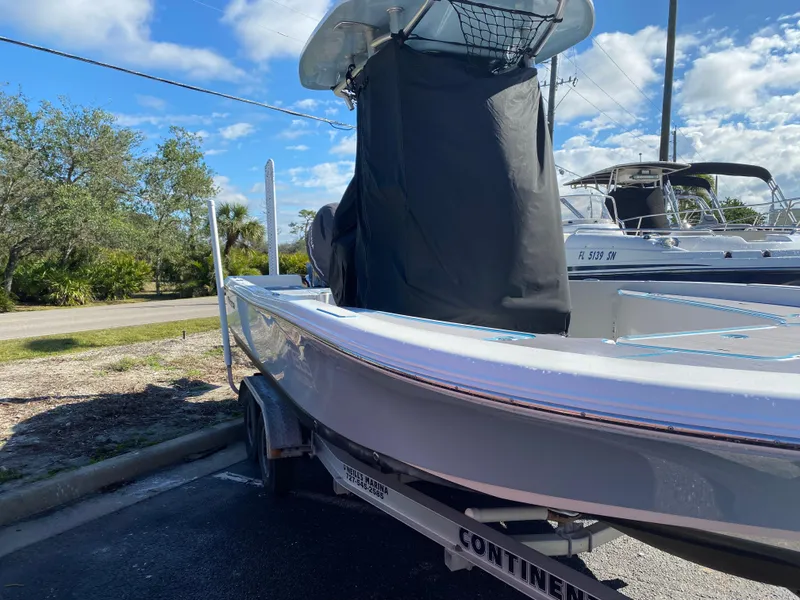 Slide: The Image of 2016 Tidewater 2200 Carolina Bay boat on trailer under blue sky. - 5