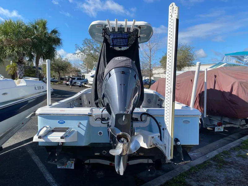 Slide: The Image of 2016 Tidewater 2200 Carolina Bay boat with outboard motor, parked in a marina. - 7