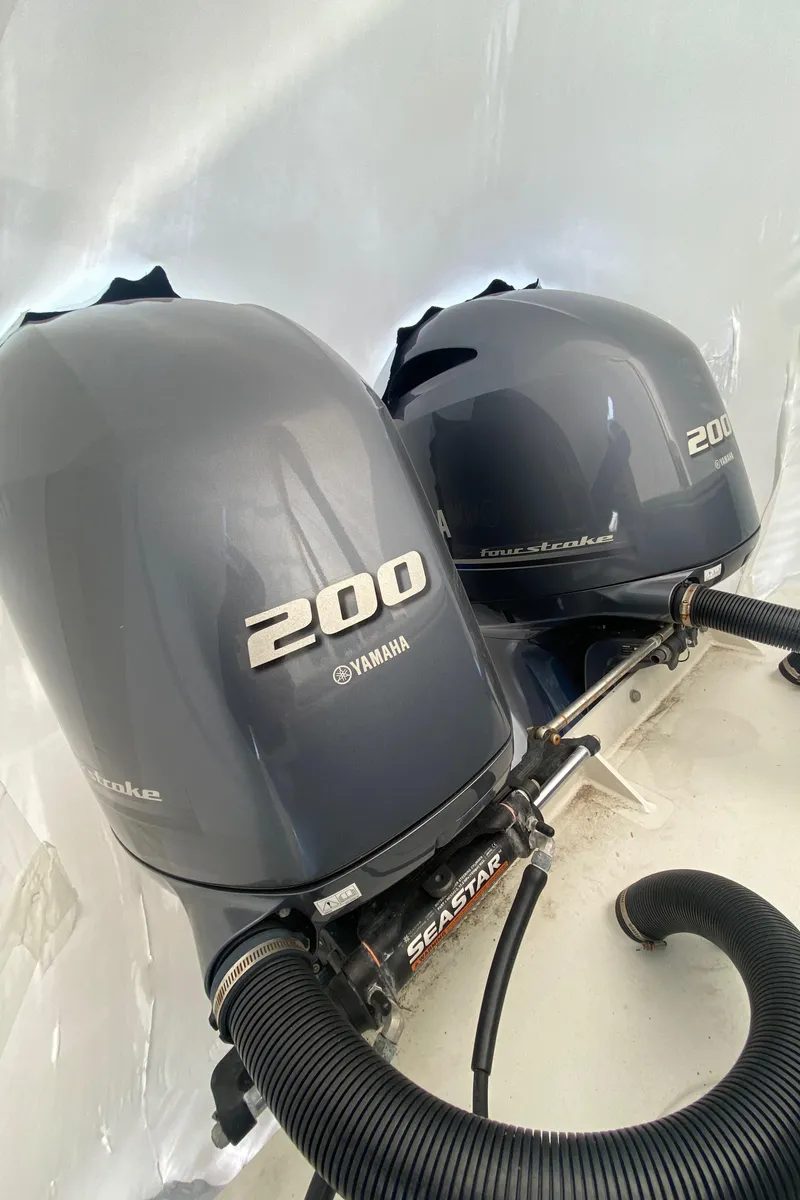 Slide: The Image of Twin Yamaha 200 outboard engines on a 2018 Parker 2530 Extended Cabin boat. - 4