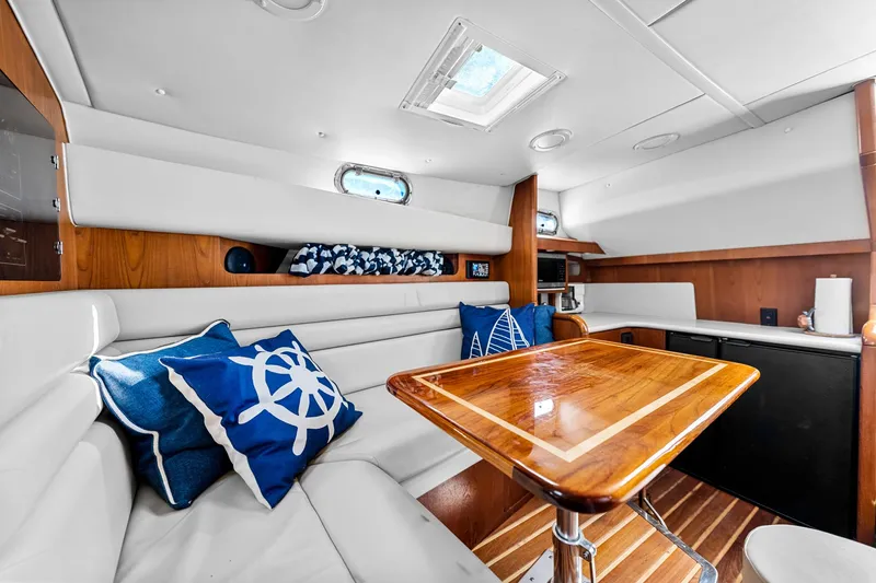 Slide: The Image of Luxurious interior of 2002 Pursuit 3800 Express yacht with elegant seating and nautical decor. - 39