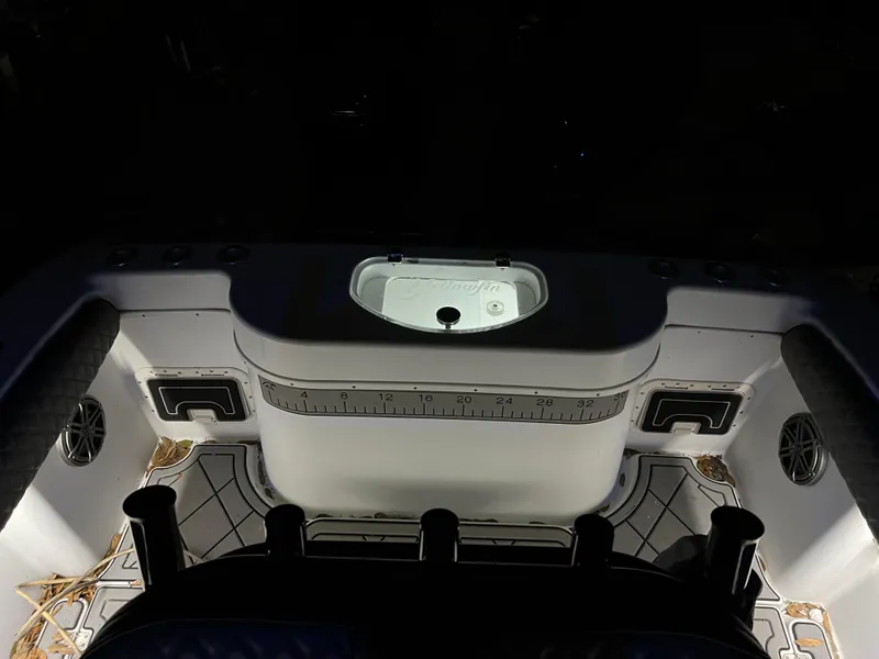 Slide: The Image of 2003 Yellowfin 23 Offshore boat interior with illuminated fishing station and rod holders. - 25