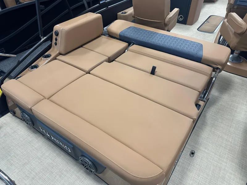 Slide: The Image of Luxurious seating on 2025 Harris Solstice 250 boat, featuring tan upholstery and modern design. - 12