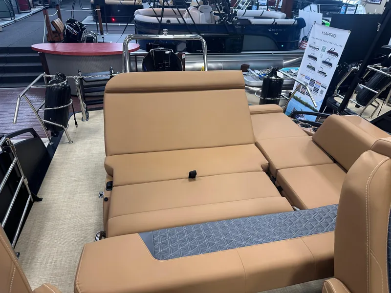 Slide: The Image of 2025 Harris Solstice 250 boat interior with tan seating and modern design. - 13