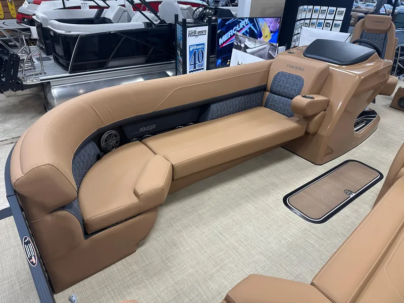 Slide: The Image of 2025 Harris Solstice 250 boat interior with tan seating and modern design. - 4