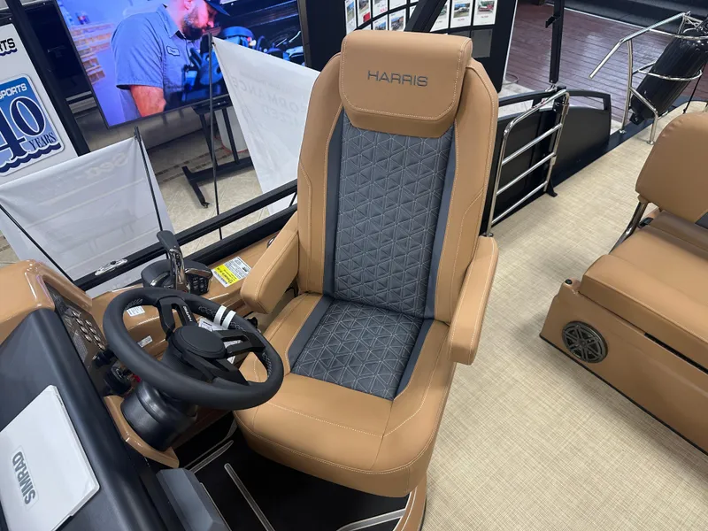 Slide: The Image of Captain's chair on 2025 Harris Solstice 250 boat, featuring tan and gray upholstery. - 7