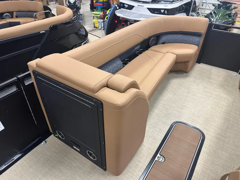 Slide: The Image of 2025 Harris Solstice 250 boat interior with tan seating and modern design. - 9