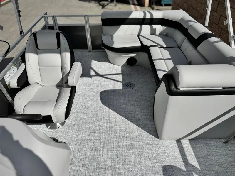Slide: The Image of Luxurious interior of 2025 Berkshire 18 CR SE pontoon boat with plush seating. - 11
