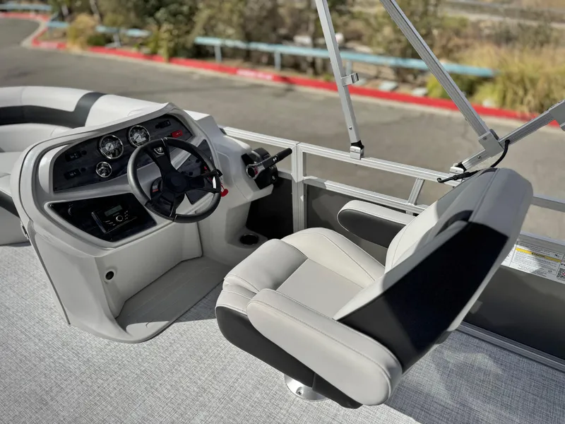 Slide: The Image of 2025 Berkshire 18 CR SE boat interior with modern steering console and comfortable seating. - 14