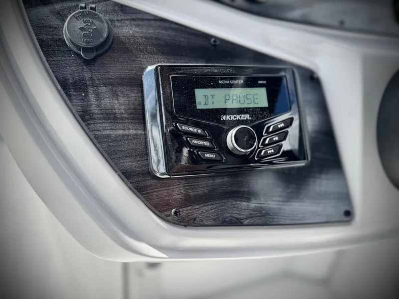 Slide: The Image of 2025 Berkshire 18 CR SE boat stereo system with digital display and control buttons. - 17