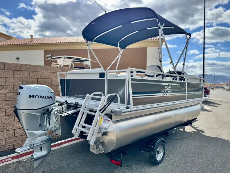 Slide: The Image of 2025 Berkshire 18 CR SE pontoon boat with Honda outboard motor and canopy. - 5