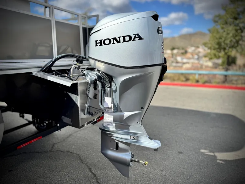 Slide: The Image of Outboard motor on a 2025 Berkshire 18 CR SE boat, featuring a Honda engine. - 6