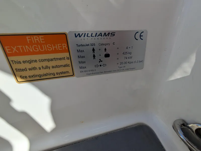 Slide: The Image of 2020 Williams Jet Tenders Turbojet 325 label with fire extinguisher information and specifications. - 15