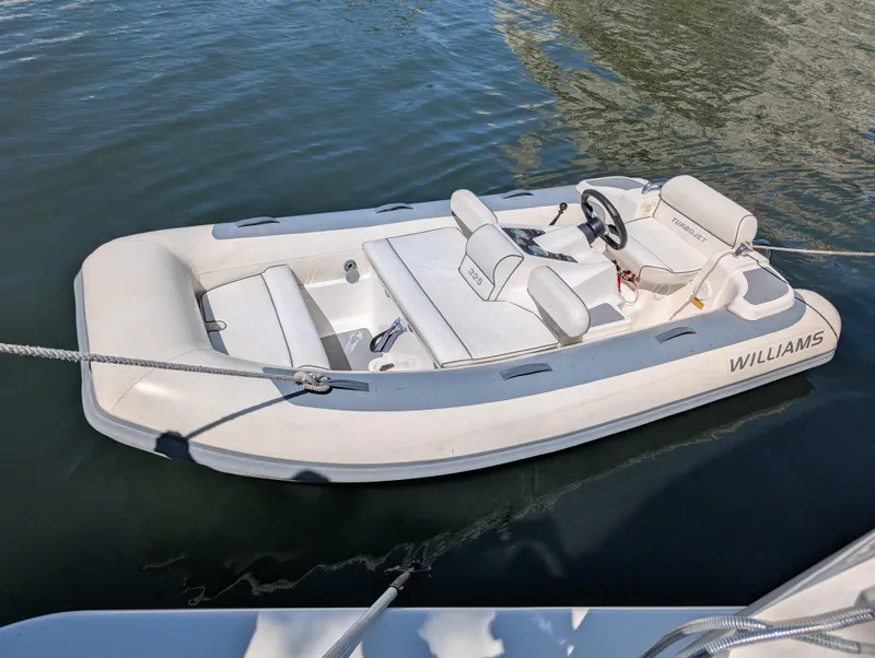 Slide: The Image of 2020 Williams Jet Tenders Turbojet 325 boat floating on water. - 4