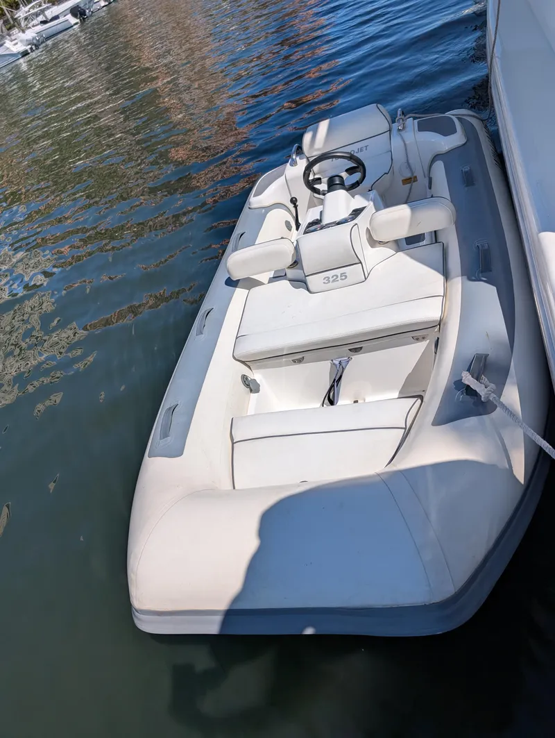Slide: The Image of 2020 Williams Jet Tenders Turbojet 325 moored on calm water. - 6