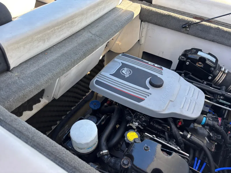 Slide: The Image of Engine compartment of a 2014 Sea Ray 205 Sport boat, showcasing detailed components. - 18