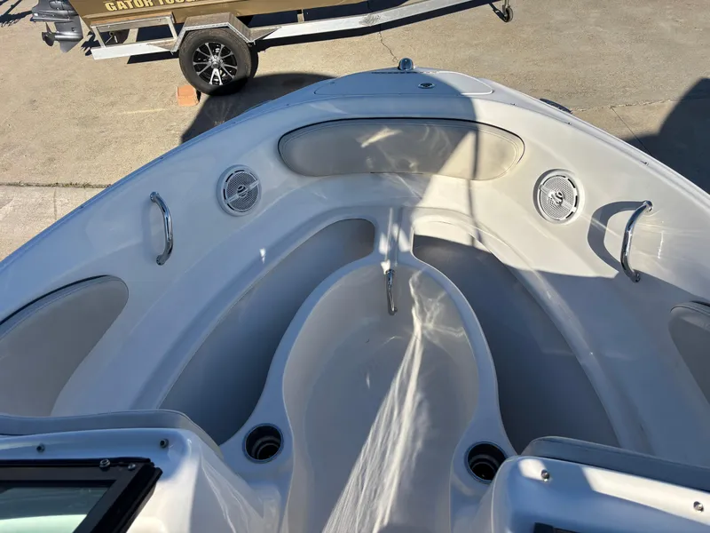 Slide: The Image of 2014 Sea Ray 205 Sport boat interior, featuring spacious seating and sleek design. - 2