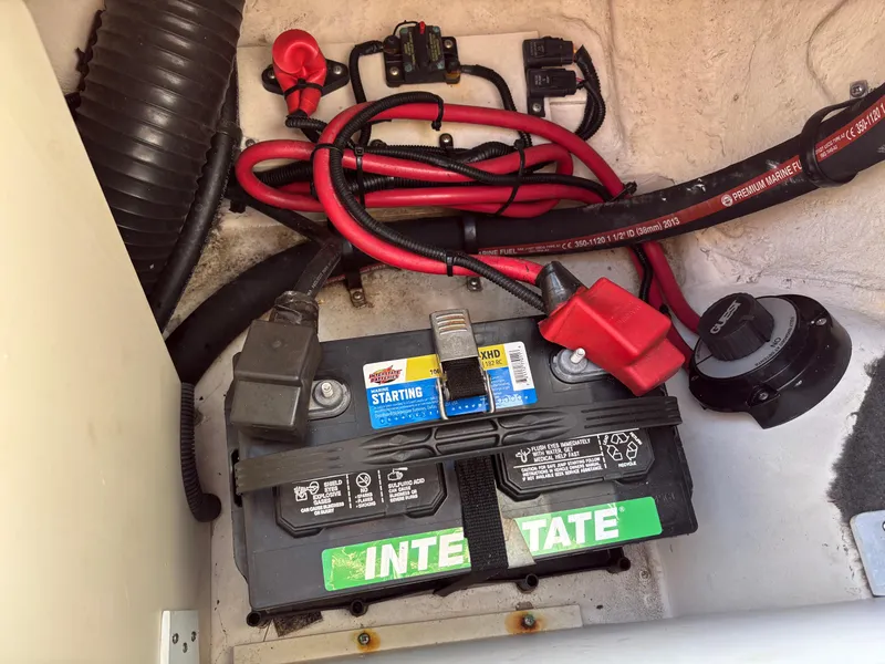 Slide: The Image of Battery compartment of a 2014 Sea Ray 205 Sport boat with Interstate battery. - 21