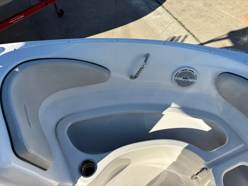Slide: The Image of Interior view of a 2014 Sea Ray 205 Sport boat, featuring seating and speaker. - 3