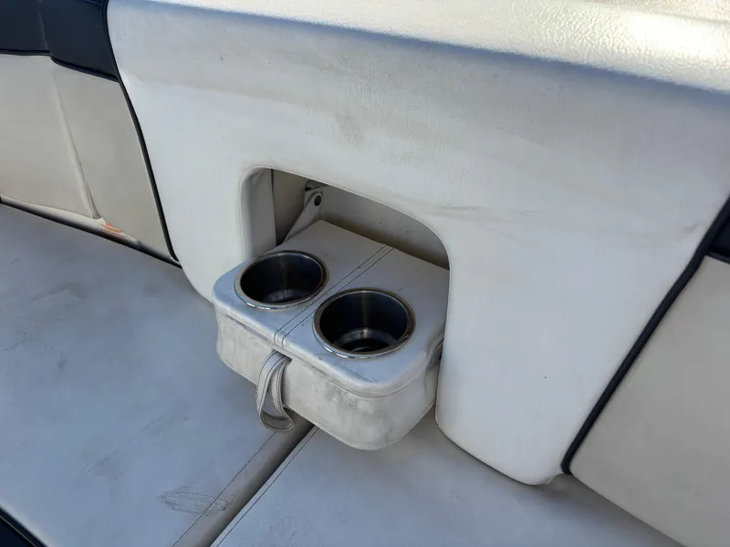 Slide: The Image of 2014 Sea Ray 205 Sport boat interior with dual cup holders. - 31