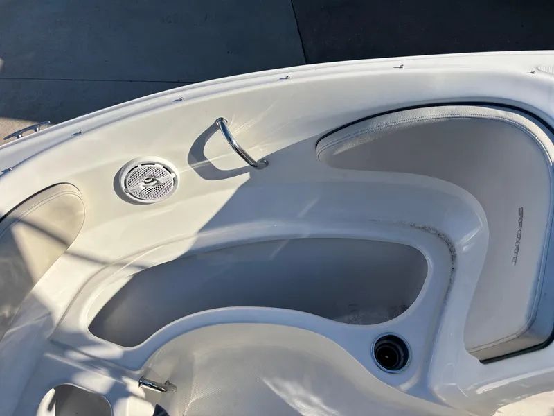 Slide: The Image of Interior view of a 2014 Sea Ray 205 Sport boat, featuring seating and speaker. - 4