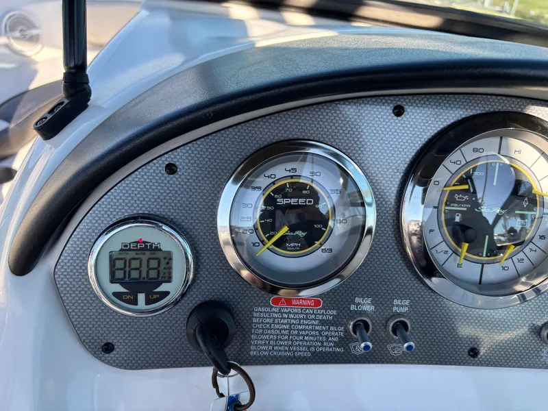 Slide: The Image of Dashboard of 2014 Sea Ray 205 Sport boat with speedometer and depth gauge. - 41