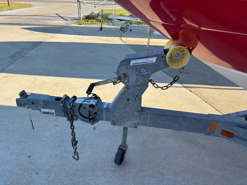 Slide: The Image of Trailer hitch of a 2014 Sea Ray 205 Sport boat in a parking area. - 43