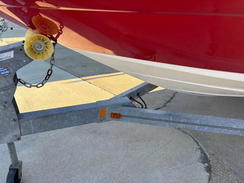 Slide: The Image of Red 2014 Sea Ray 205 Sport boat on trailer, close-up view. - 44