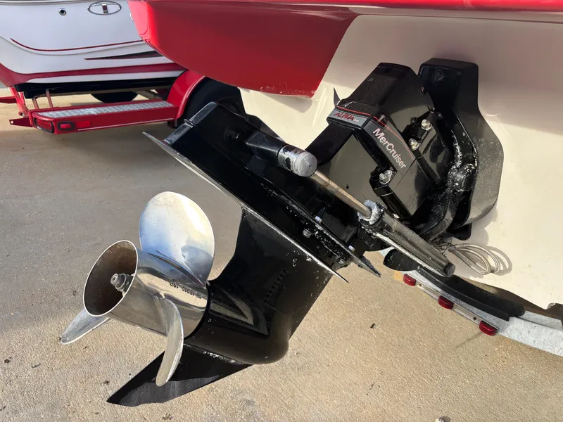 Slide: The Image of 2014 Sea Ray 205 Sport boat with MerCruiser outboard motor and propeller. - 49