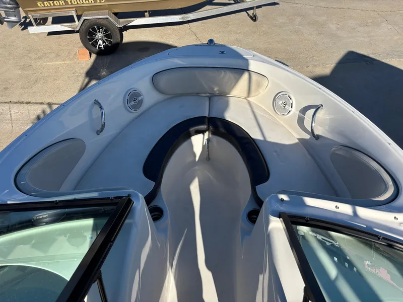Slide: The Image of 2014 Sea Ray 205 Sport boat interior with seating and speakers. - 6