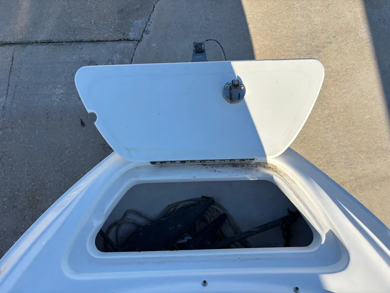 Slide: The Image of Open storage compartment on a 2014 Sea Ray 205 Sport boat. - 7