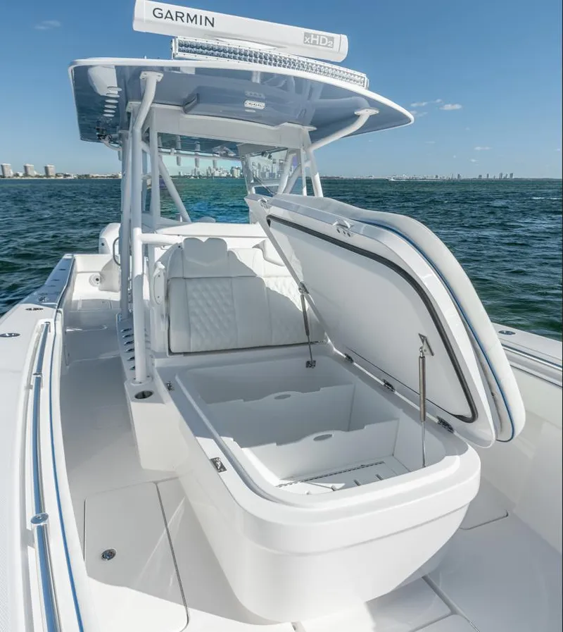 Slide: The Image of 2026 Invincible 36 Open Fisherman boat with open storage, on calm sea. - 11