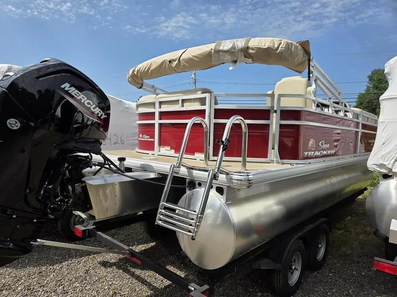 Slide: The Image of 2025 Sun Tracker PB 20 DLX pontoon boat with Mercury engine on trailer. - 10