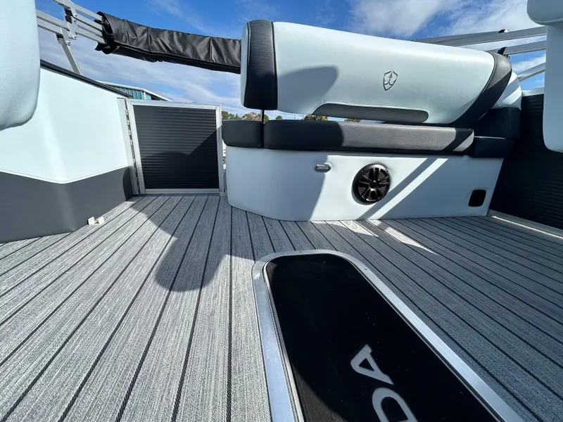 Slide: The Image of Interior of 2025 Armada Drakkar K-23SB 3T boat with sleek seating and modern flooring. - 12