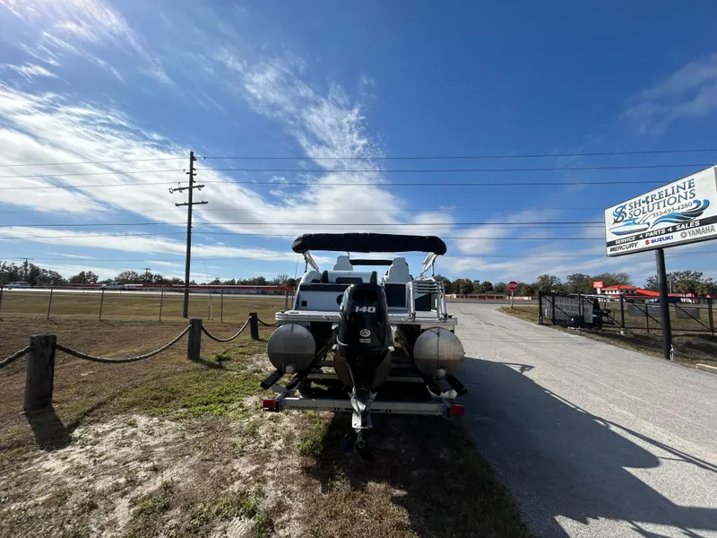 Slide: The Image of Armada Drakkar K-23SB 3T boat on trailer under clear sky, 2025 model. - 16