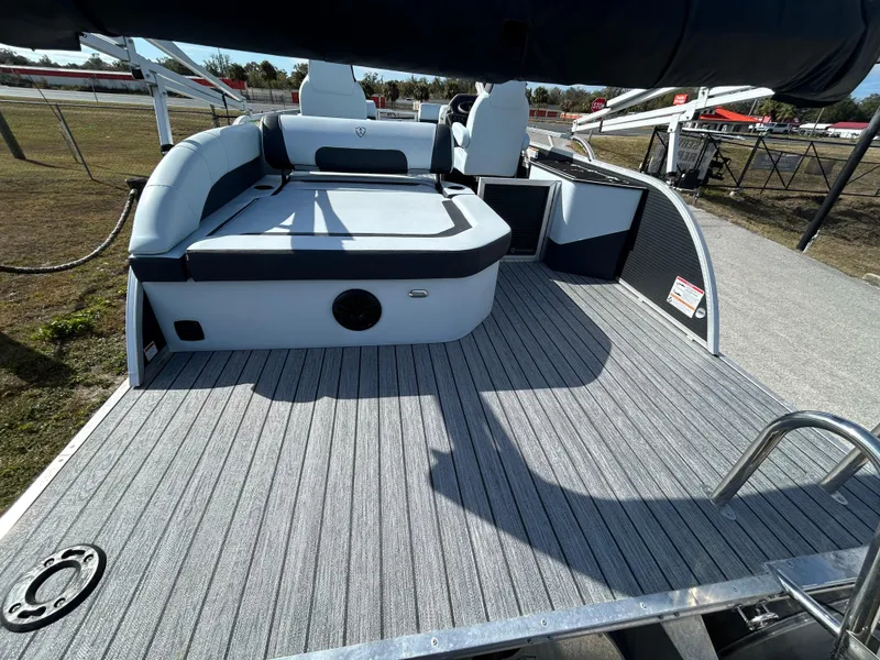 Slide: The Image of 2025 Armada Drakkar K-23SB 3T boat deck with seating and modern design. - 17