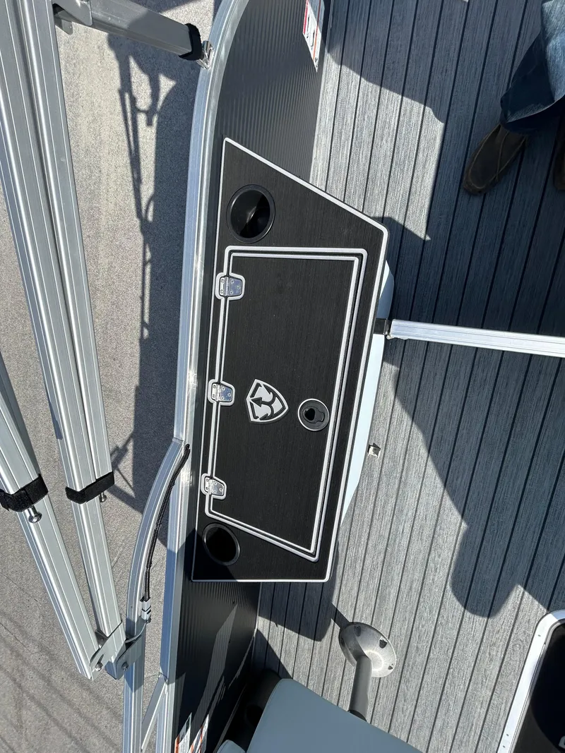 Slide: The Image of Armada Drakkar K-23SB 3T 2025 boat deck with sleek design and cup holders. - 19