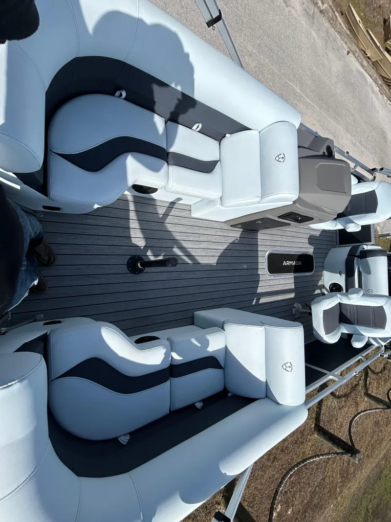 Slide: The Image of 2025 Armada Drakkar K-23SB 3T boat interior with sleek seating and modern design. - 5