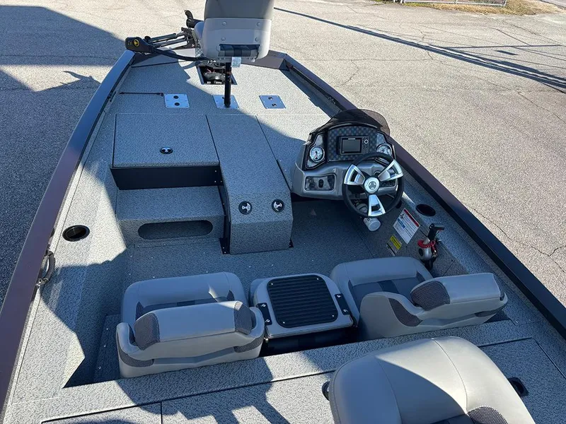 Slide: The Image of 2025 G3 Sportsman 1710 boat interior with steering console and seating. - 10