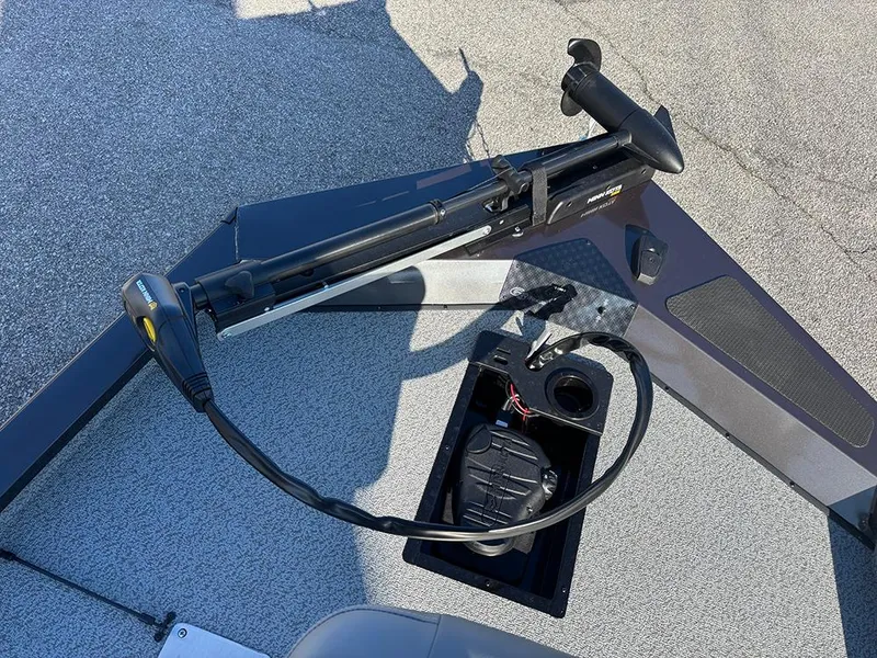 Slide: The Image of 2025 G3 Sportsman 1710 boat deck with trolling motor and storage compartment. - 12